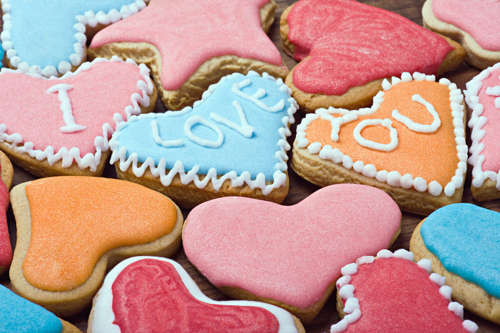 graphicstock-valentine-cookies-with-the-words-i-love-you-on-the-table_rQEQeUufhl.jpg